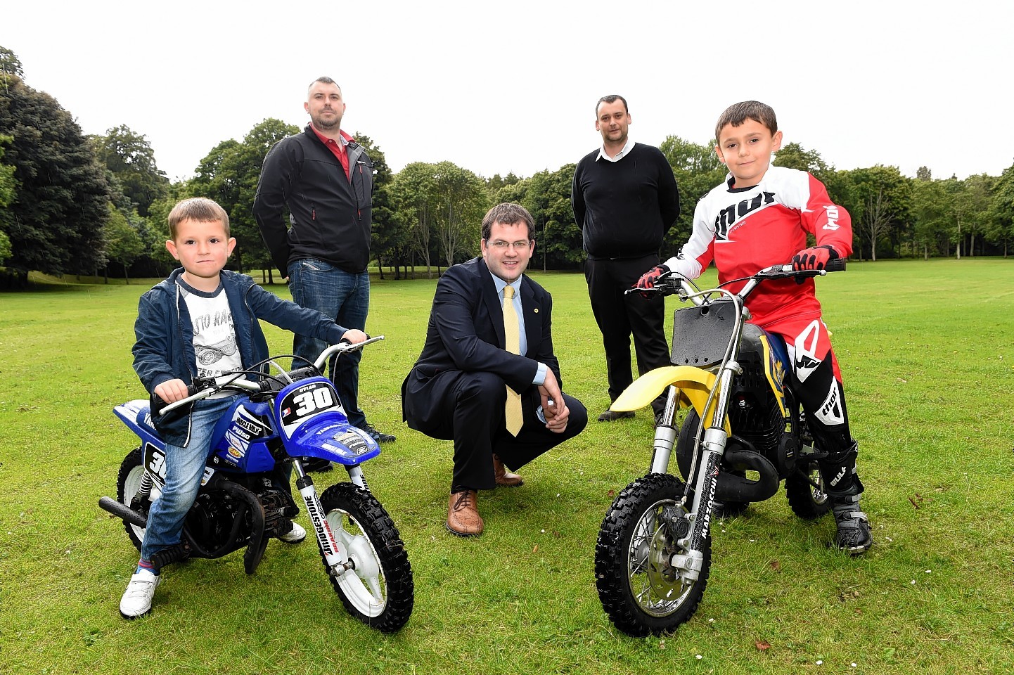 Steven Thorndick with his son Dylan,4,  and Steven Riddell with his son Glenn, 7, and coucillor Mark McDonald. Picture by Kevin Emslie