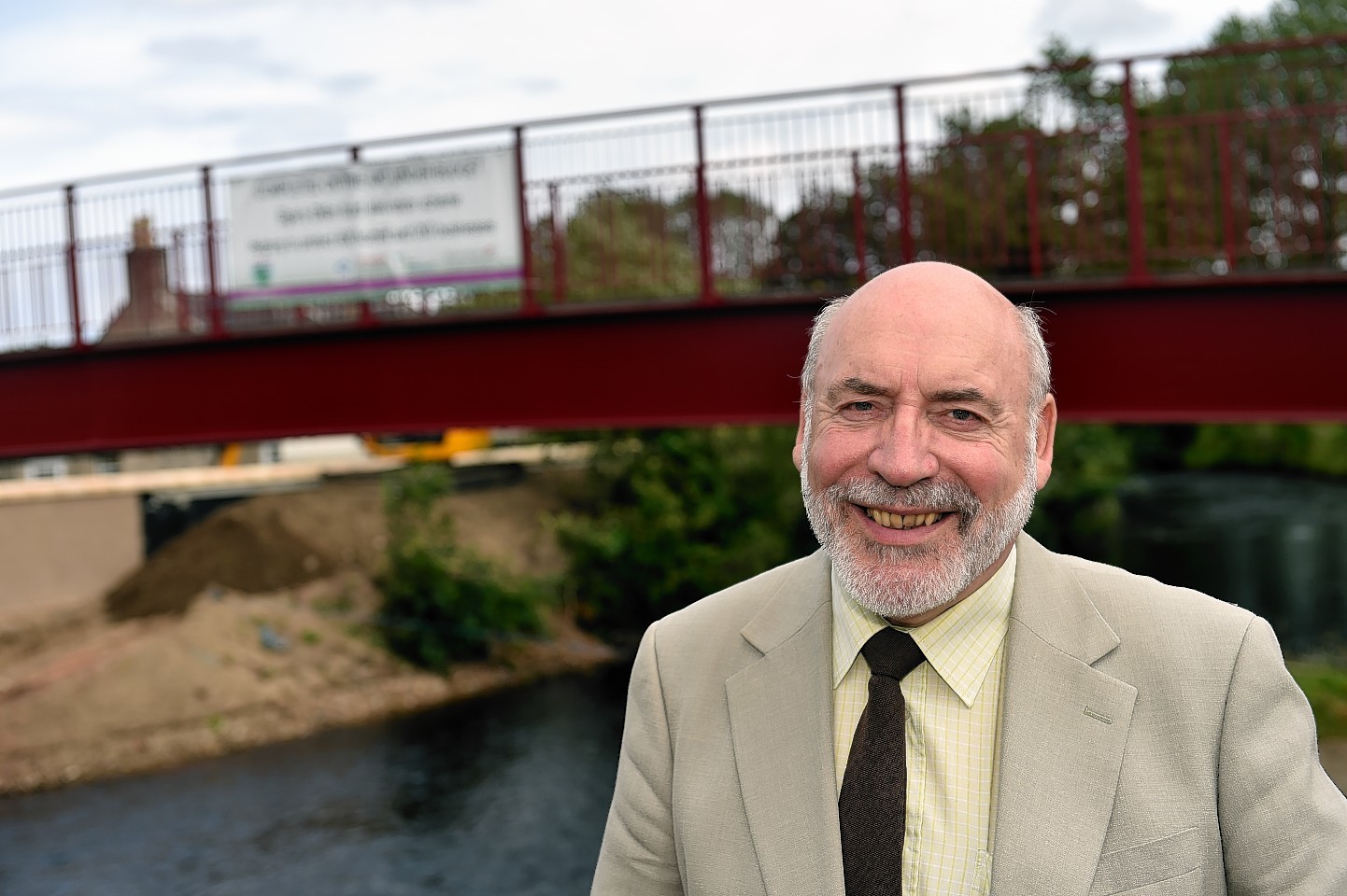 Stewart Cree, leader of the Council, beside the Lossie Wynd Bridge