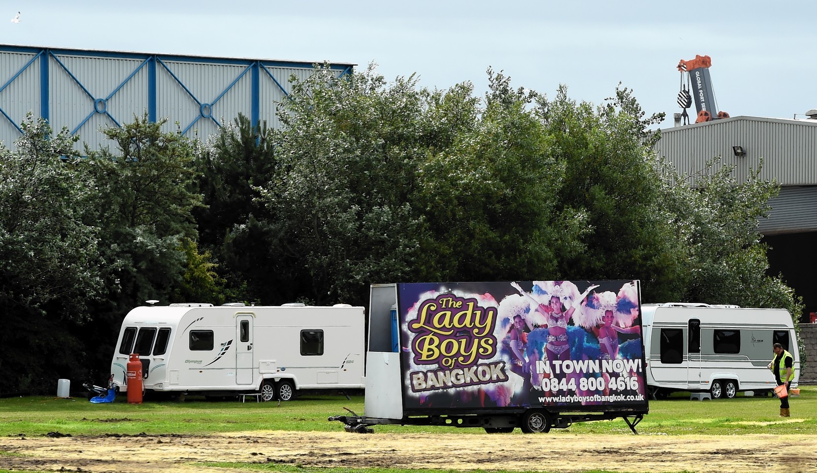 Travellers down at Aberdeen beach on the area vacated by the Lady Boys of Bangkok.