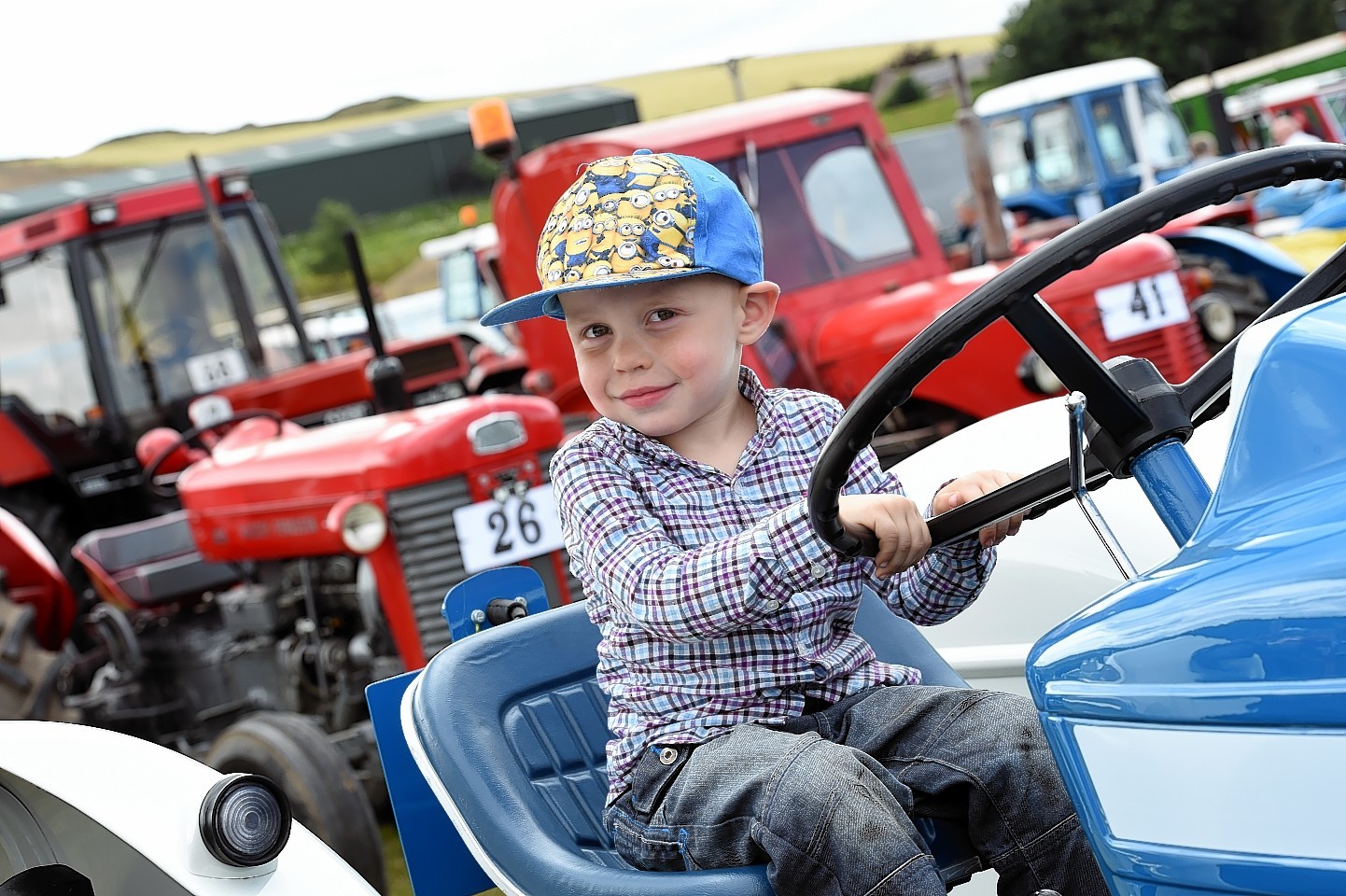 Spectators of all ages enjoyed the show, including Jamie McIntosh from Turriff in his grandad's Ford tractor 