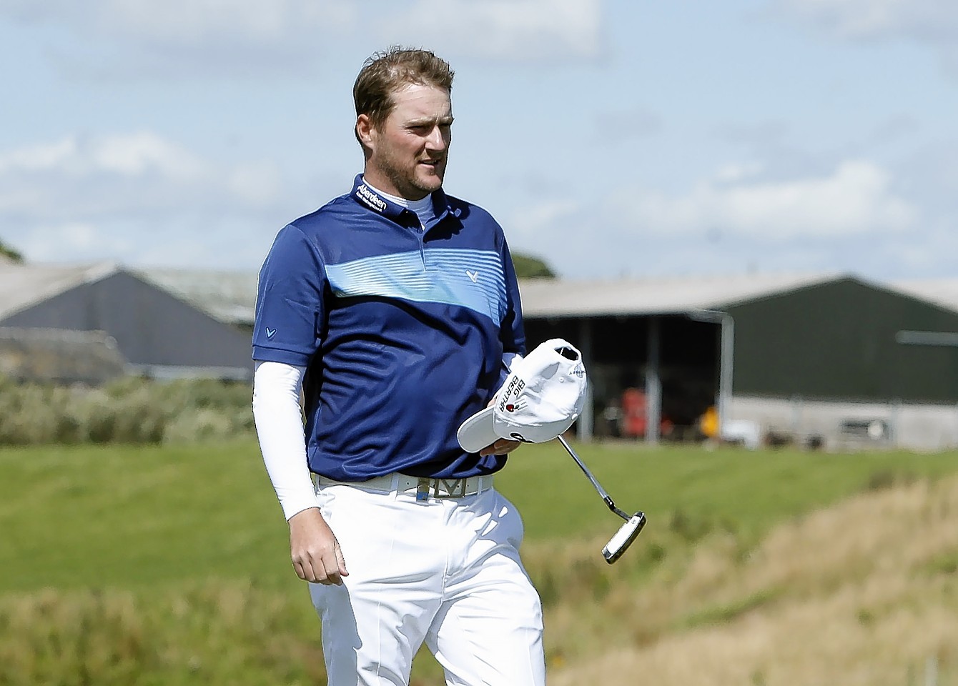 Scotland's Marc Warren walks off the 16th green on Sunday