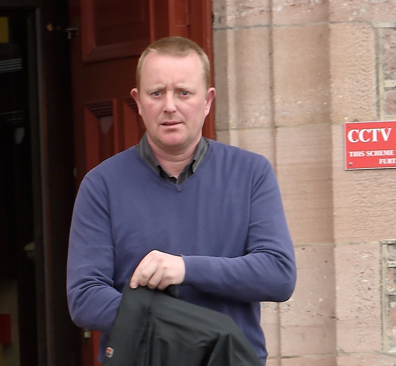 John Duff of Forres leaves Inverness Sheriff Court after appearing on theft charges.