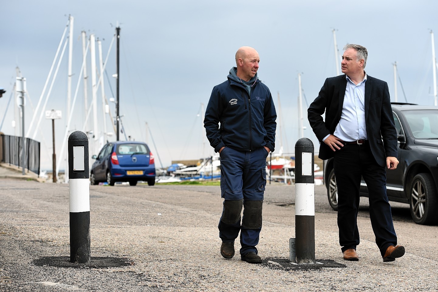 Lossiemouth garage owner, John Thomson, left, with Richard Lochhead, MSP, Picture by Gordon Lennox