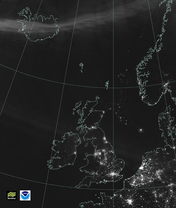 The UK from outer space with the haze of the Northern Lights sweeping across Iceland and northern England