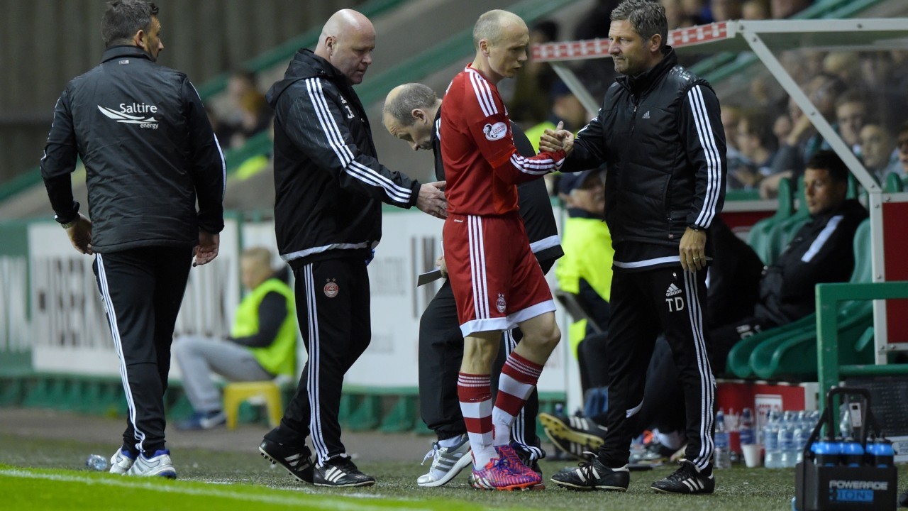 Willo Flood approaches the bench after his injury