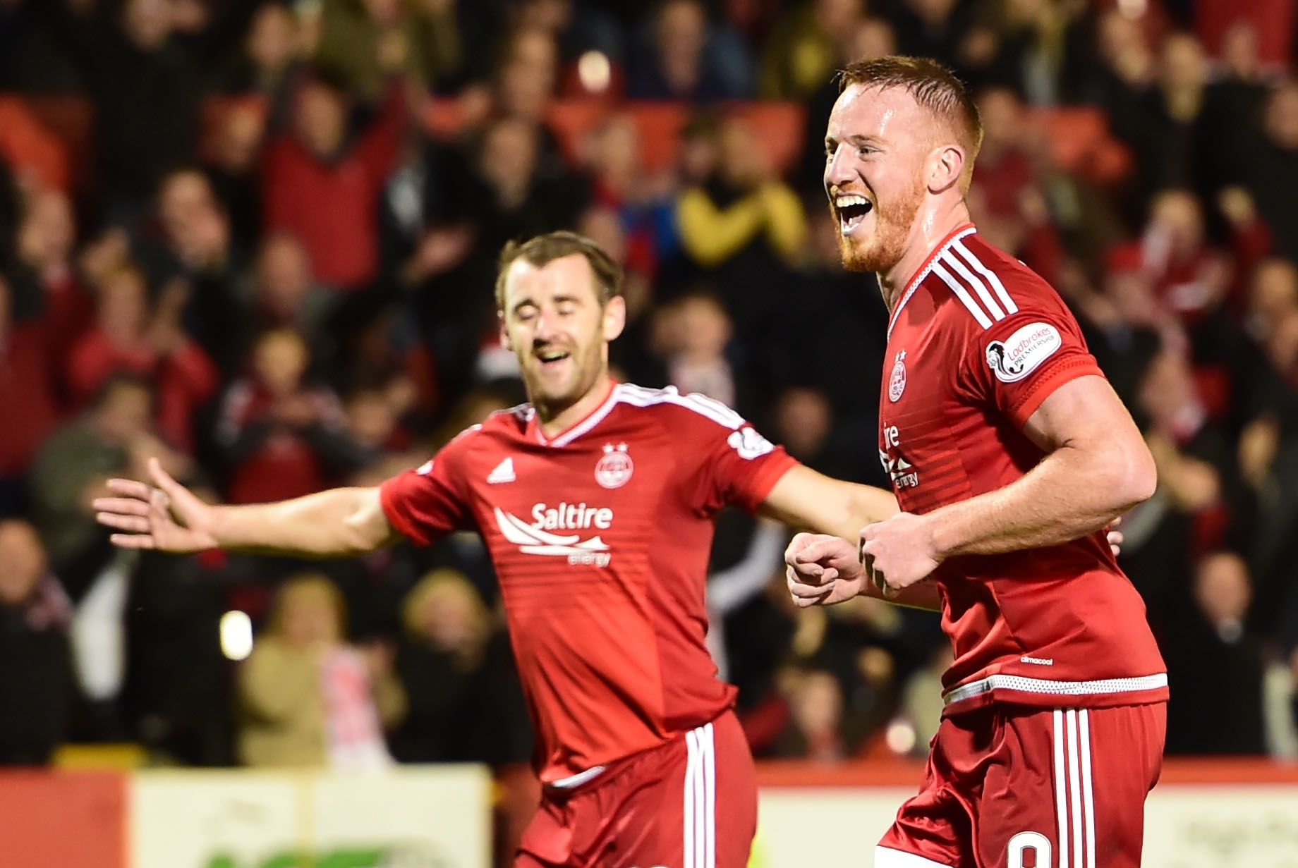 Aberdeen's Adam Rooney (right) celebrates having fired home from the penalty spot to put his side ahead