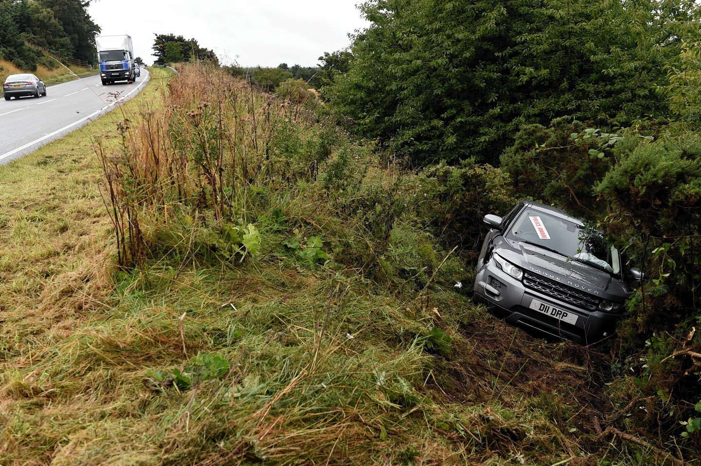 The Landrover ran down the side of the roadside embankment