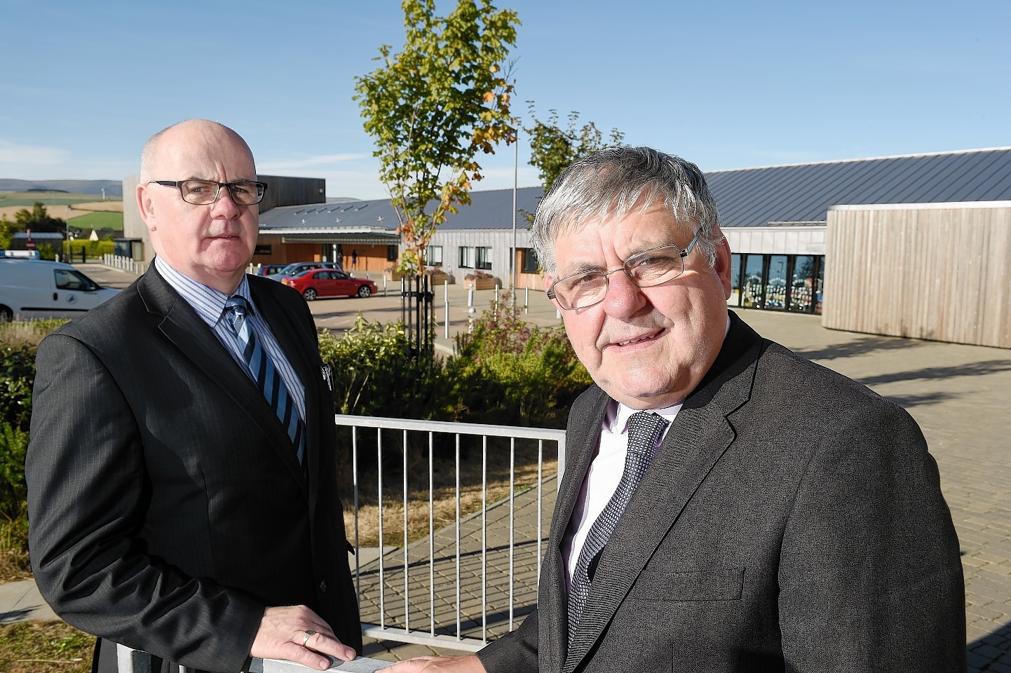 Councillors Alister Mackinnon and Graham MacKenzie outside the school yesterday