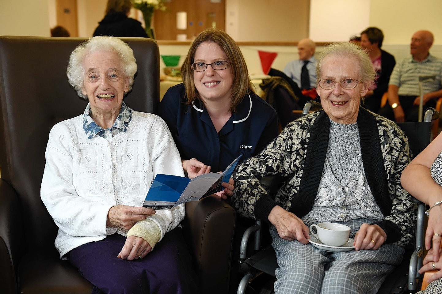 Residents and staff enjoying the ribbon cutting ceremony