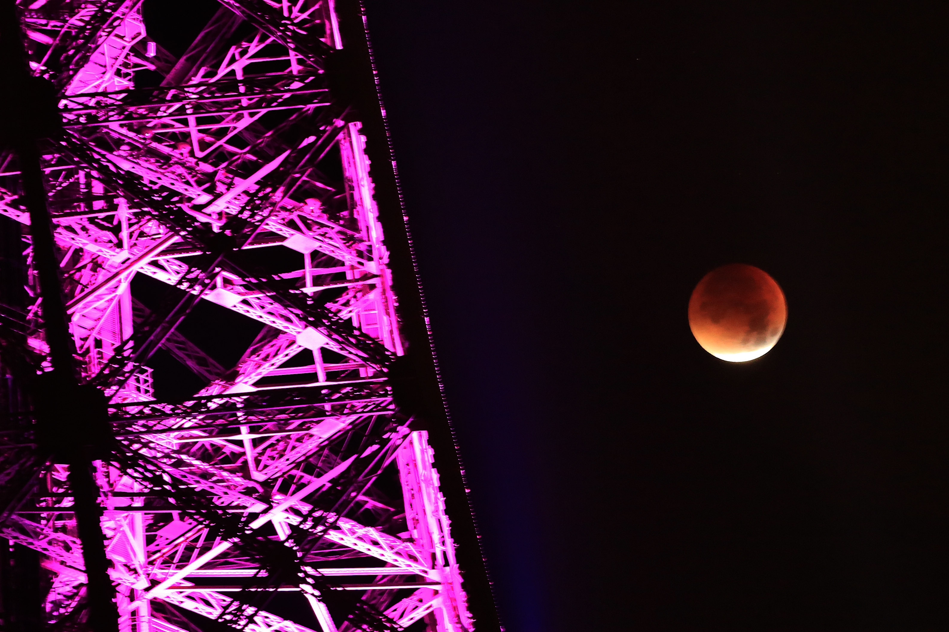 Seen near the Eiffel Tower, during a total lunar eclipse, in Paris