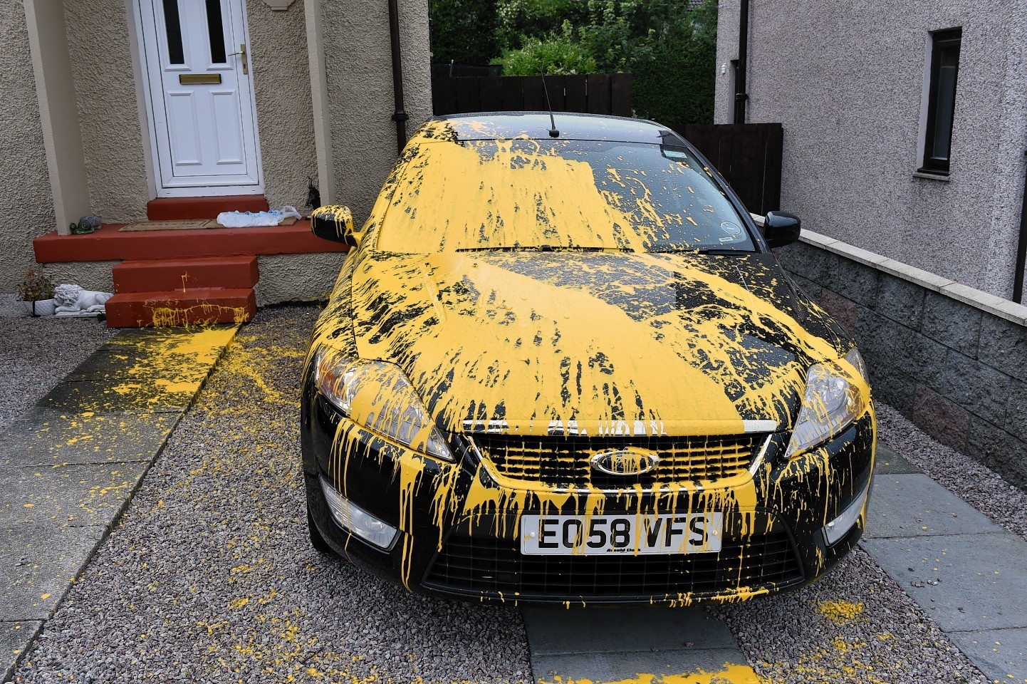 A Ford car was badly damaged with yellow paint on Byron Avenue