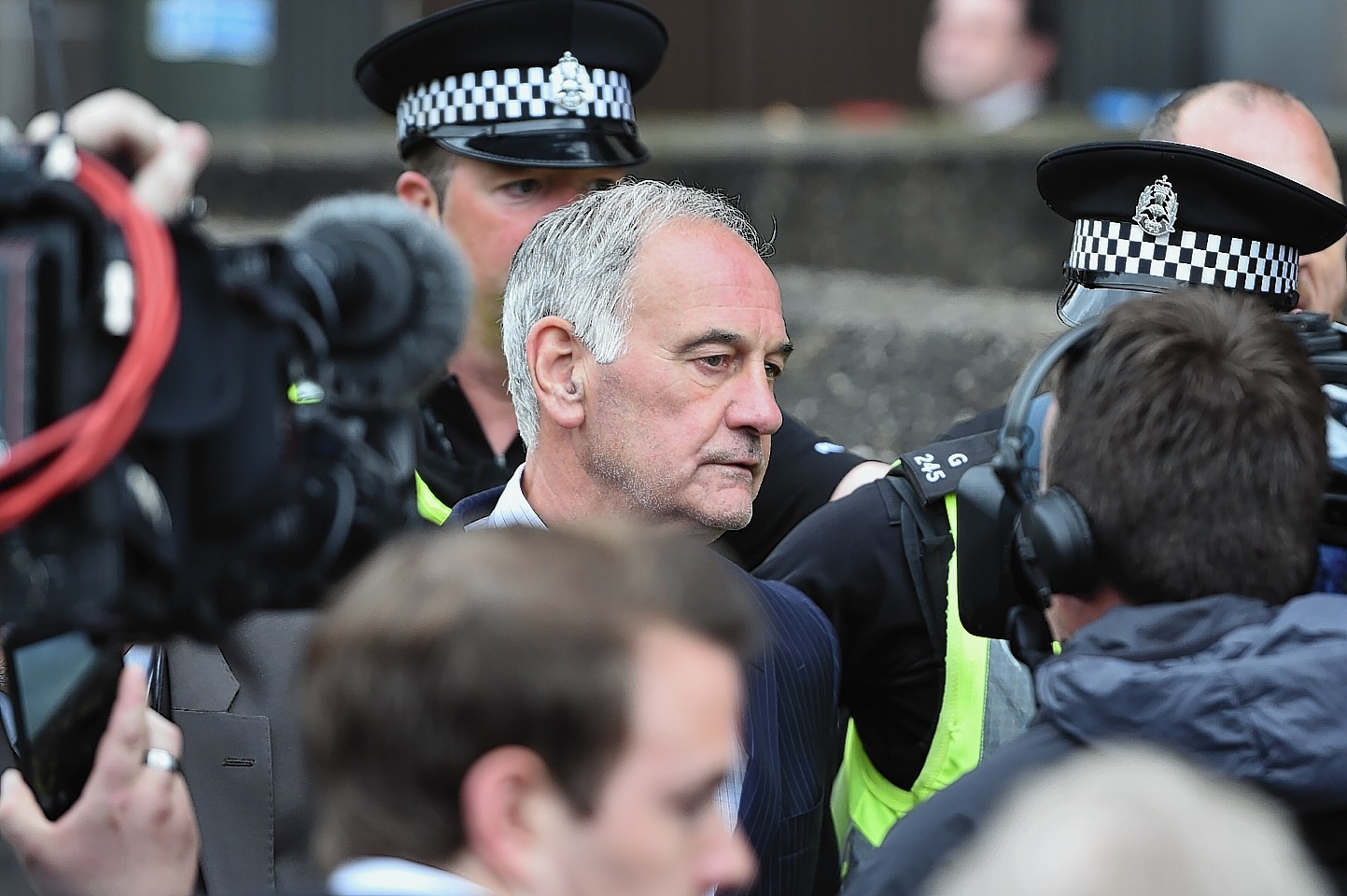 Former Rangers chief executive Charles Green leaves court surrounded by police