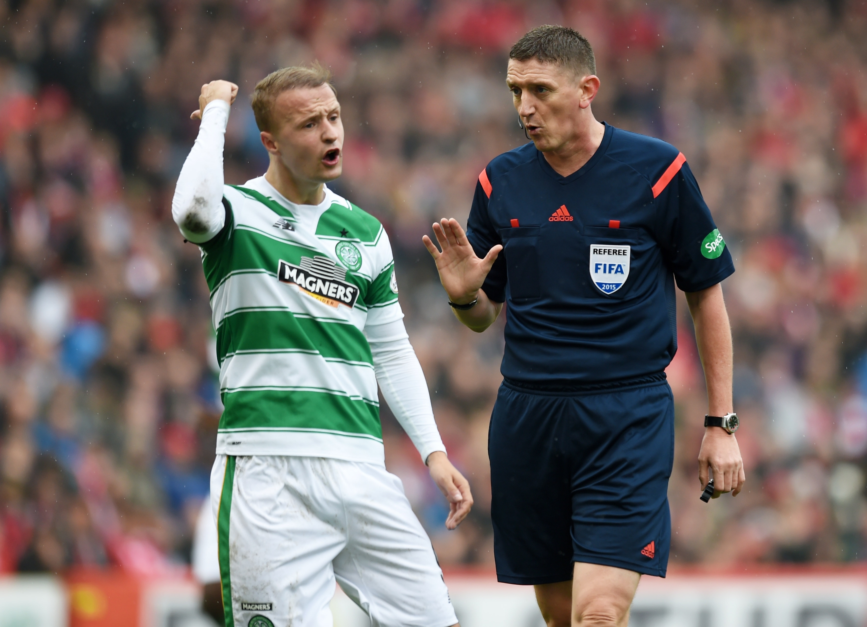 Leigh Griffiths (left) appeals to referee Craig Thomson, suggesting Andrew Considine should have been sent off