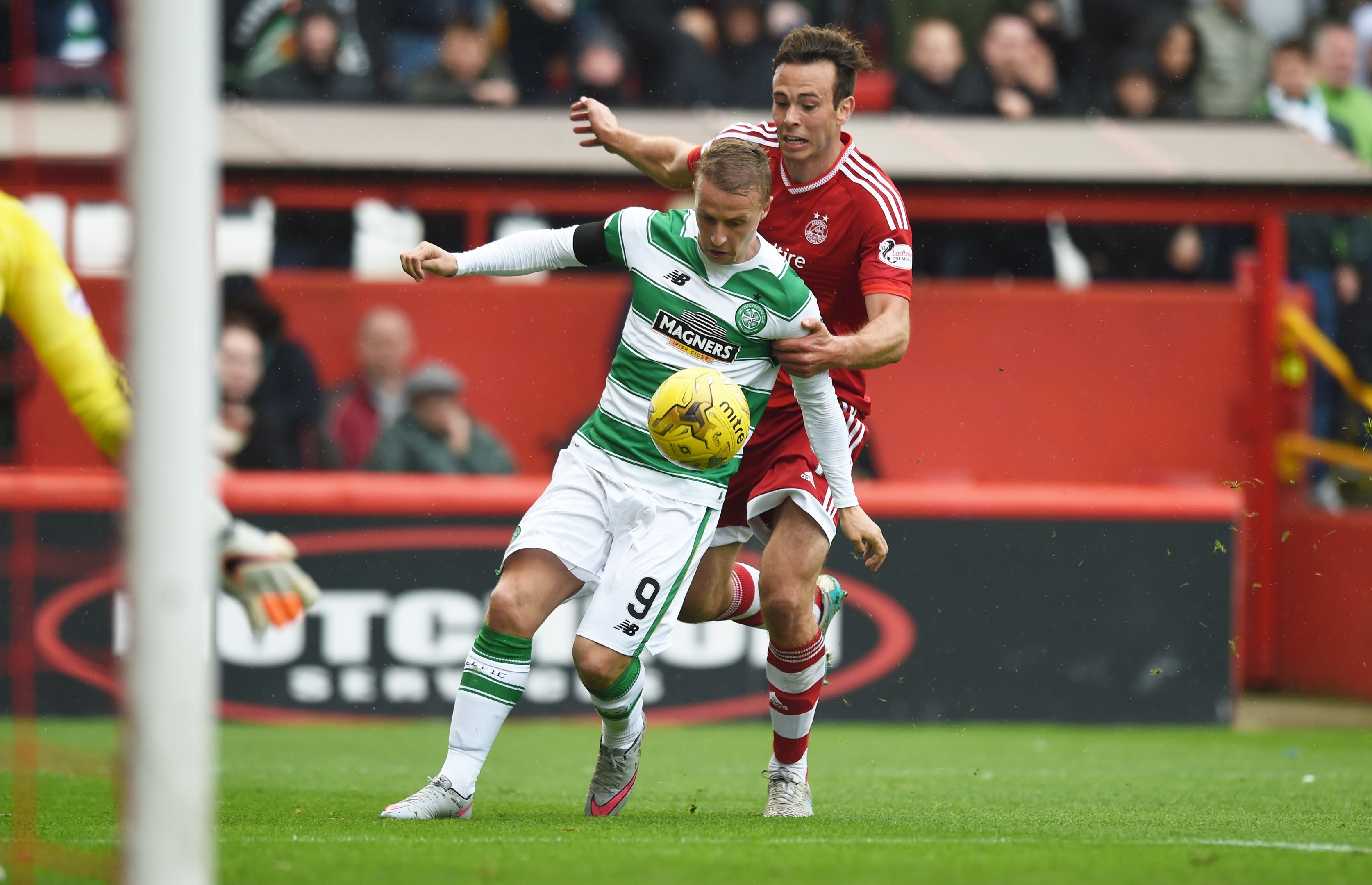 Griffiths (left) is brought down by Andrew Considine to win a penalty