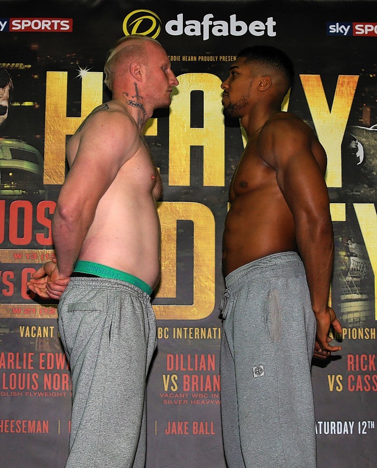 Anthony Joshua (right) and Gary Cornish during the weigh in at the Reebok Sports Club, London.