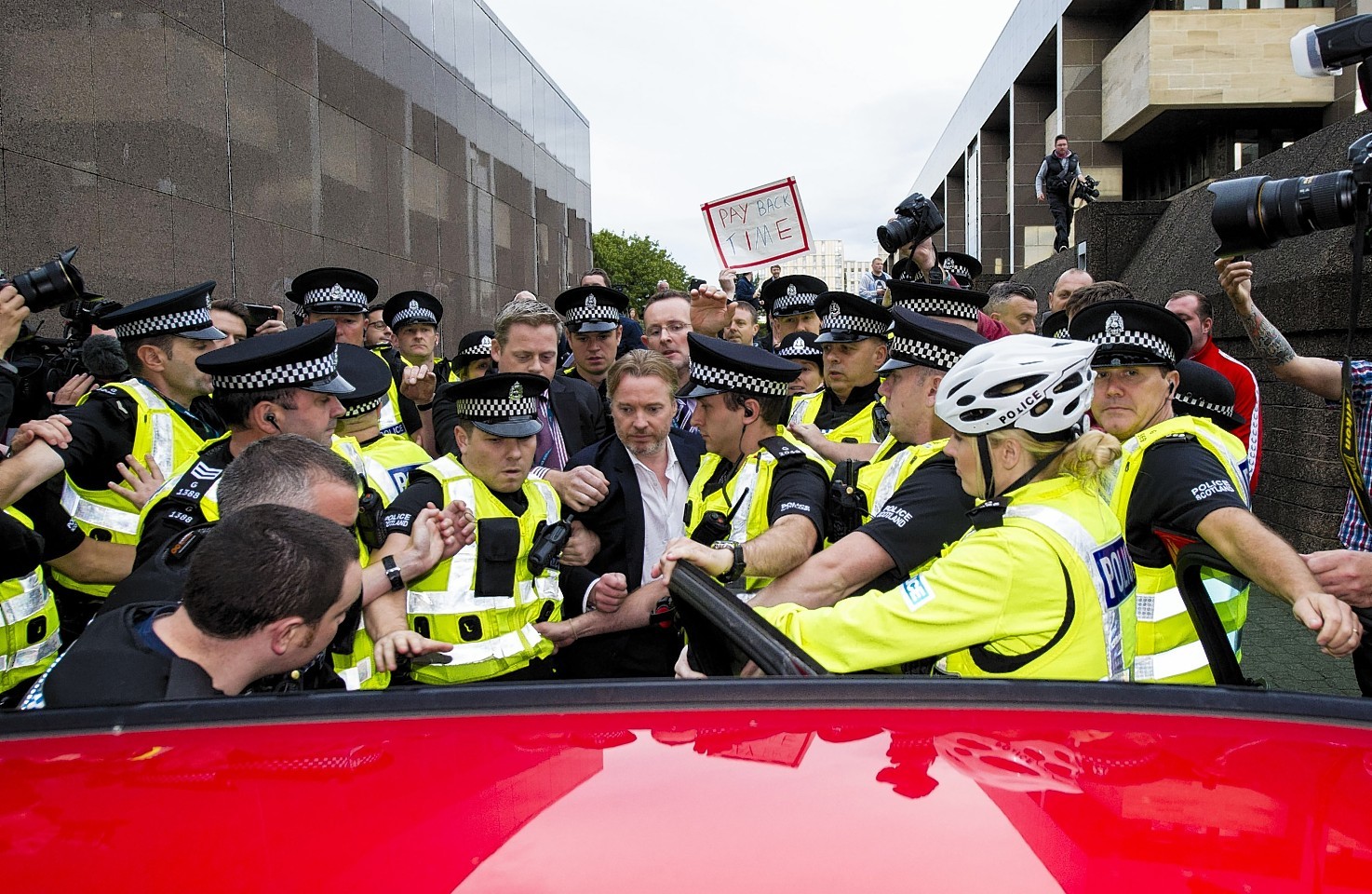 Craig Whyte leaves court surrounded by police