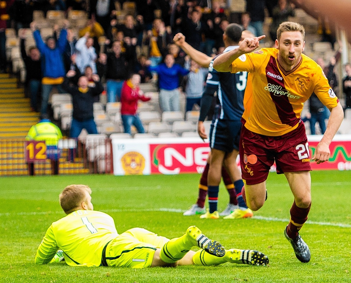 Scott Fox is left on the floor as Motherwell's Louis Moult celebrates scoring the late equaliser