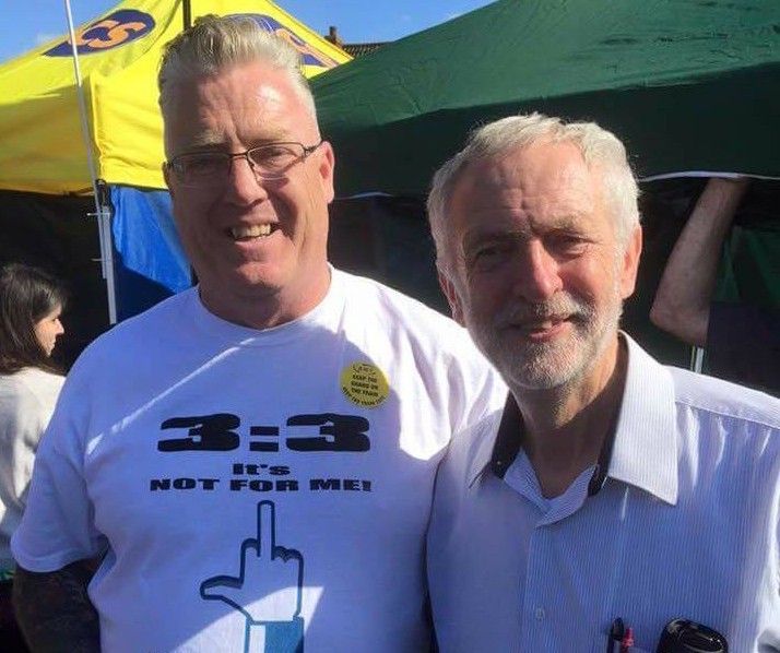 Jeremy Corbyn with the three-on, three-off protester