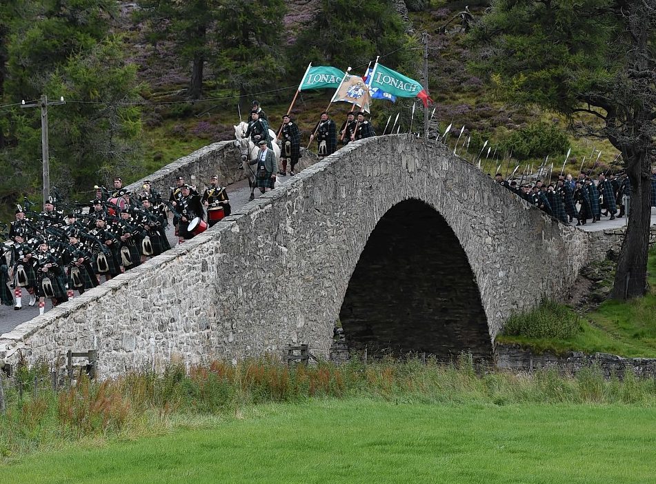 Lonach Highlanders pass across the historic Gairnshiel Bridge. Image: Colin Rennie/DC Thomson.