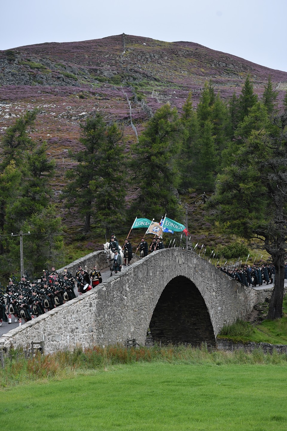 Lonach Highlnaders pass across the historic Gairnshiel Bridge. Picture: Colin Rennie.