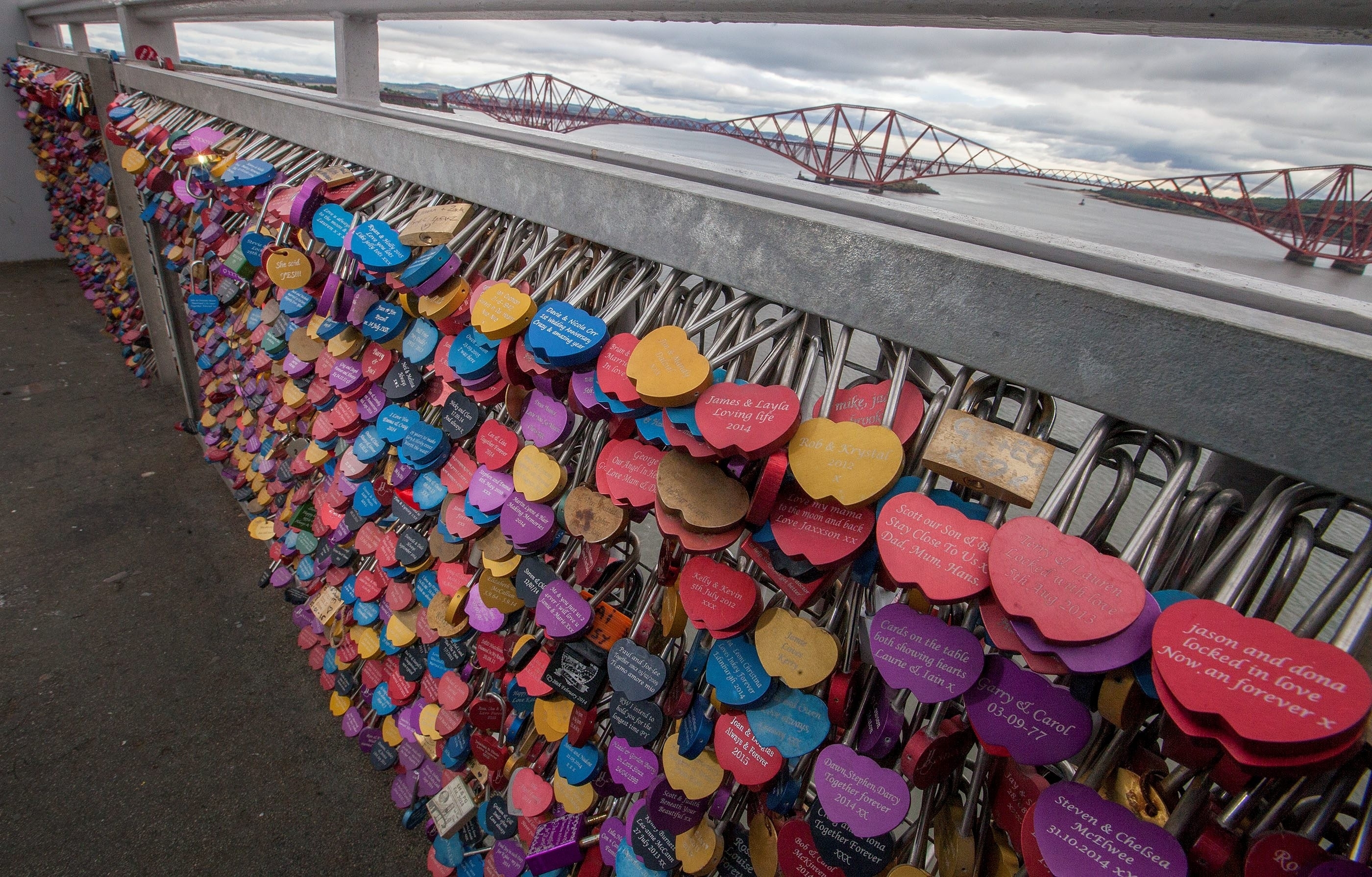 Influenced by bridges in Florence, Italy and Paris, France, the scheme was dreamed up by  the Mark Your Spot project, inviting couples to lock their love on the Forth Road Bridge.