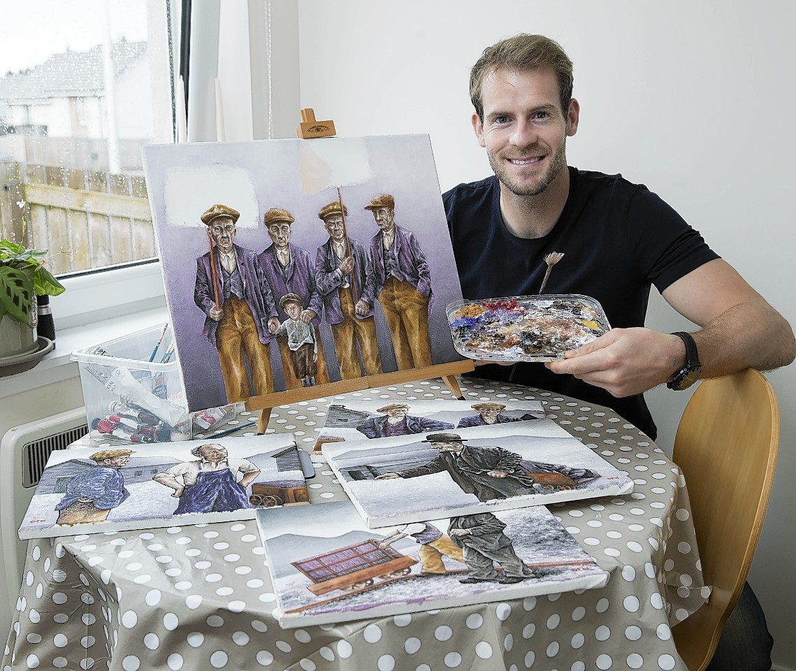Owain Fon Williams  shows off some of his work