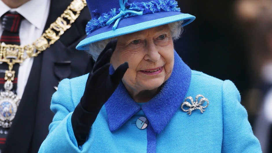 The Queen arrives at Edinburgh's Waverley Station on the day she becomes Britain's longest reigning monarch
