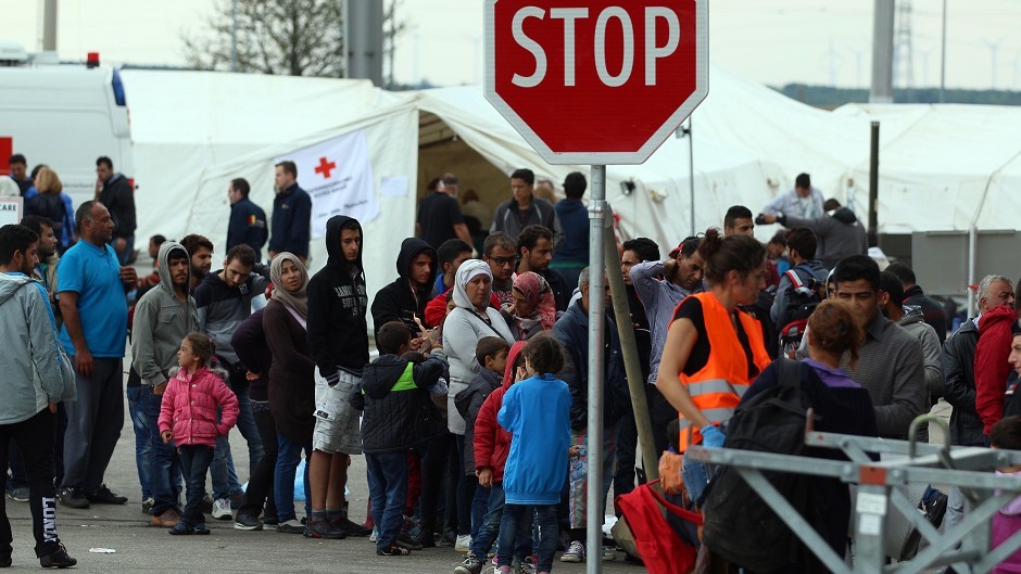 Refugees waiting in Nickelsdorf on the Austria-Hungary border (AP)