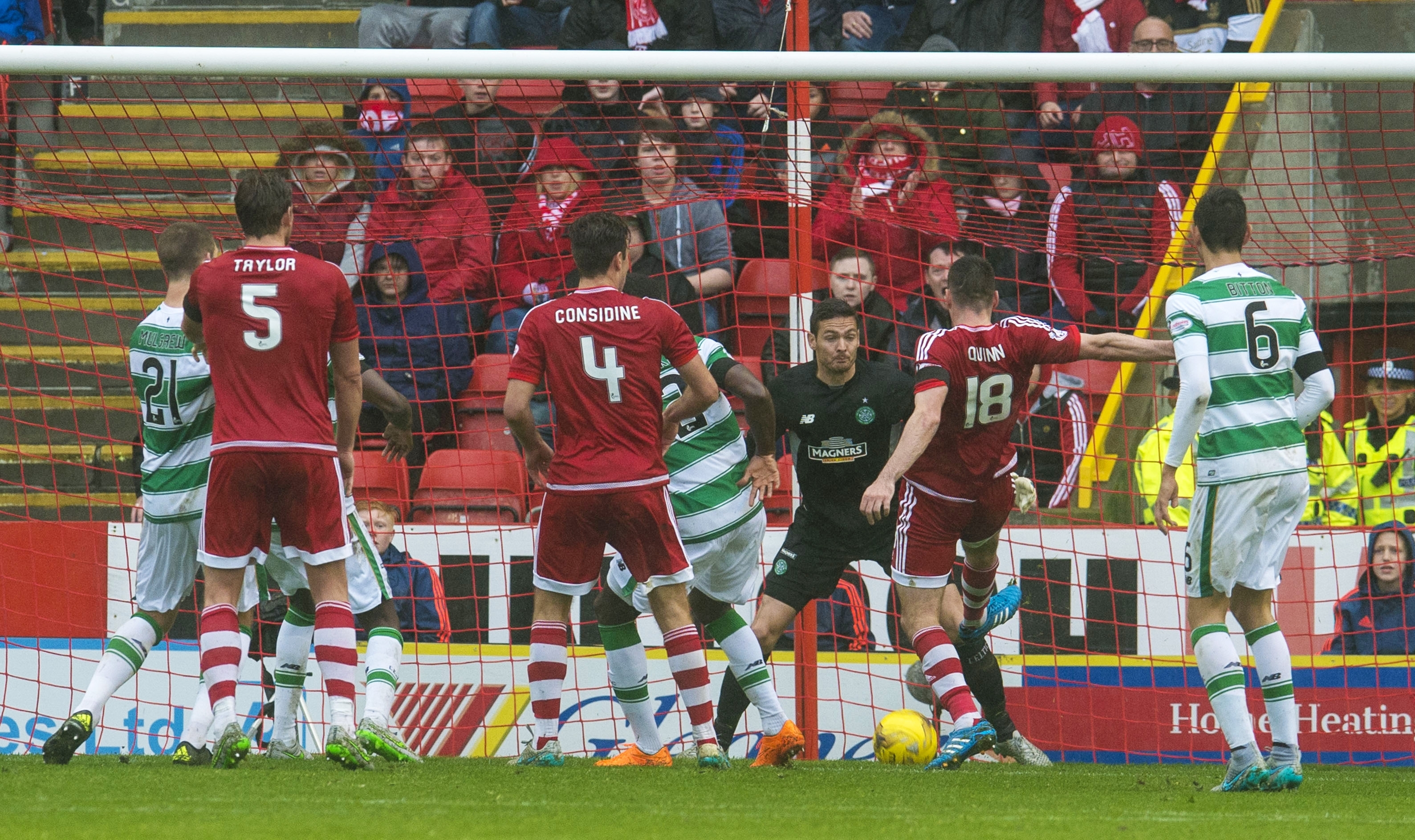 Aberdeen's Paul Quinn (2nd from right) scores the winner at Pittodrie yesterday