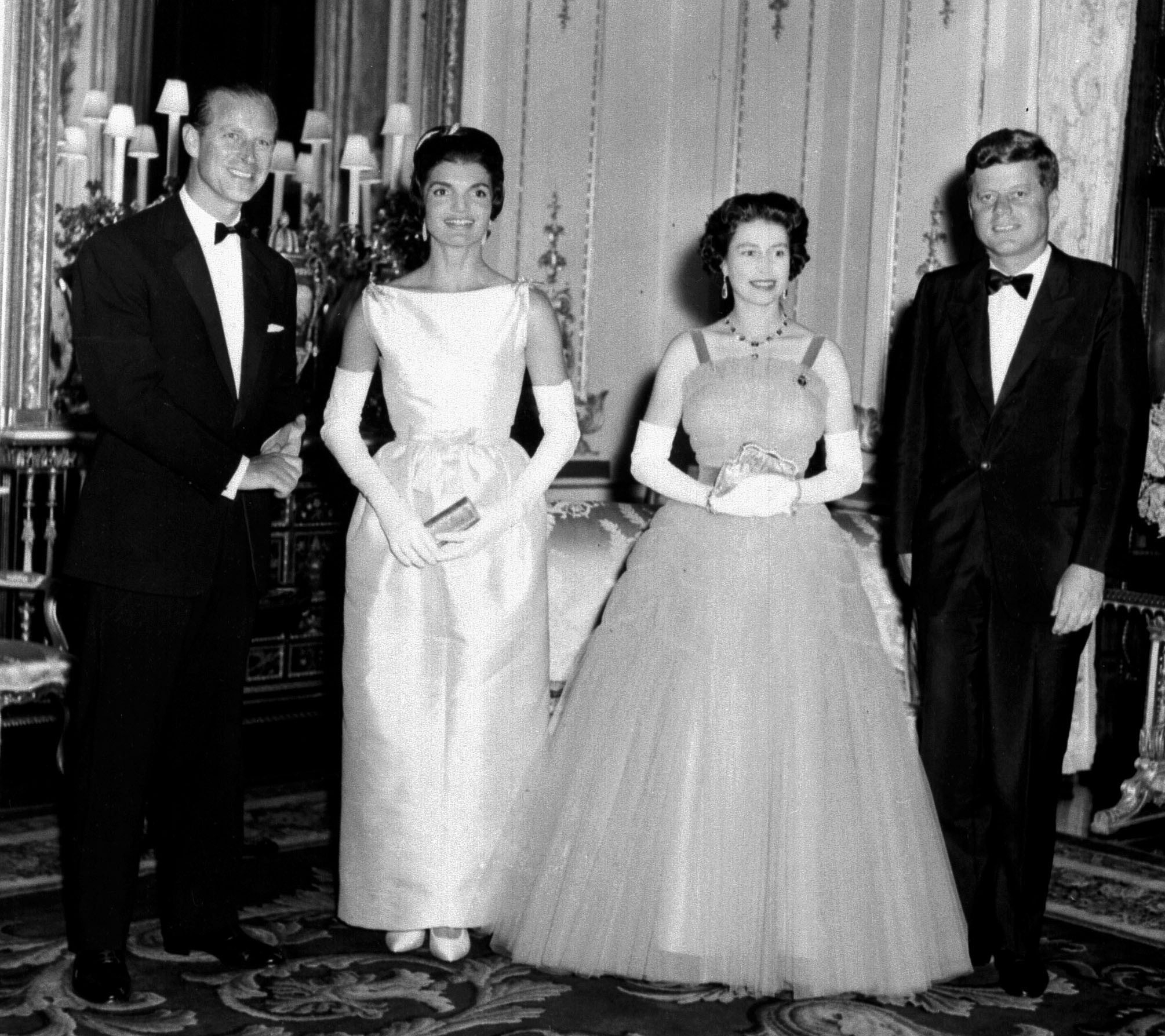  President John Kennedy (right) and his wife Jacqueline (2nd left) pictured with Queen Elizabeth II (2nd right) and the Duke of Edinburgh at Buckingham Palace, in London. The American couple were guests of the Queen and her husband at dinner. 