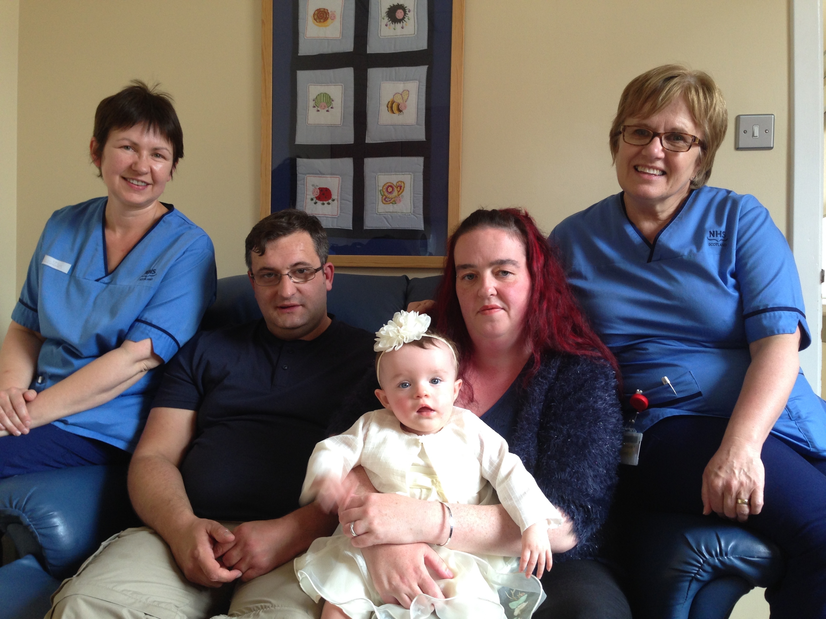 Staff Midwife Sheilagh Grace, Chris Kelly, Kelly Macrae, Staff Midwife Sharon Lawrence; front Amelia Jo Kelly