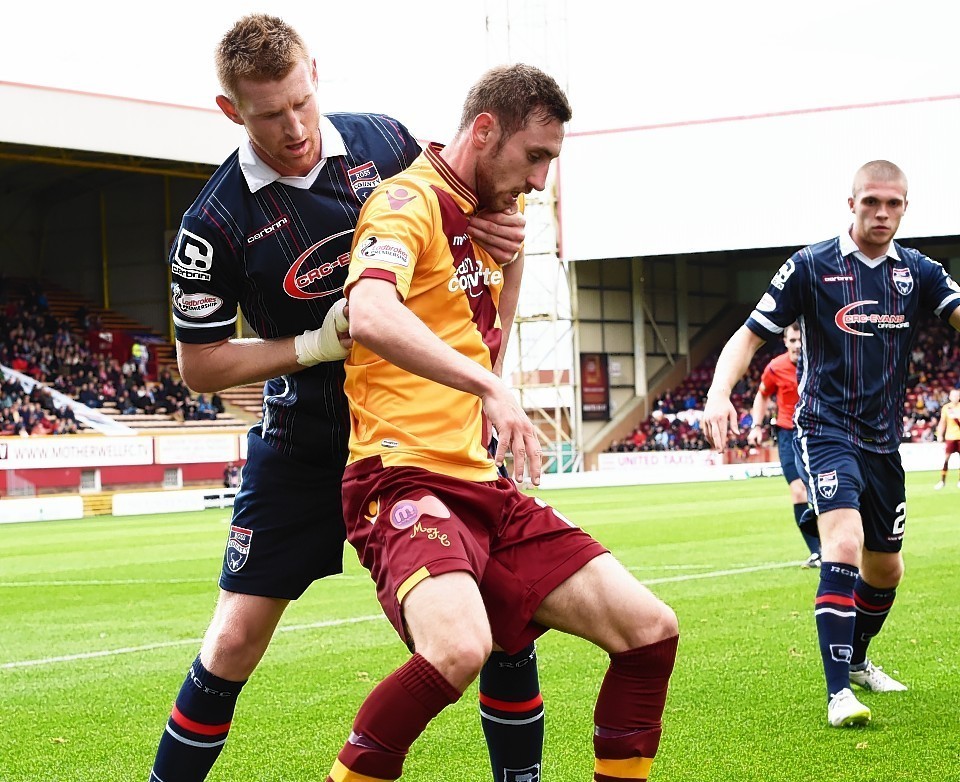 Chris Robertson challenges Motherwell's Louis Moult on Saturday