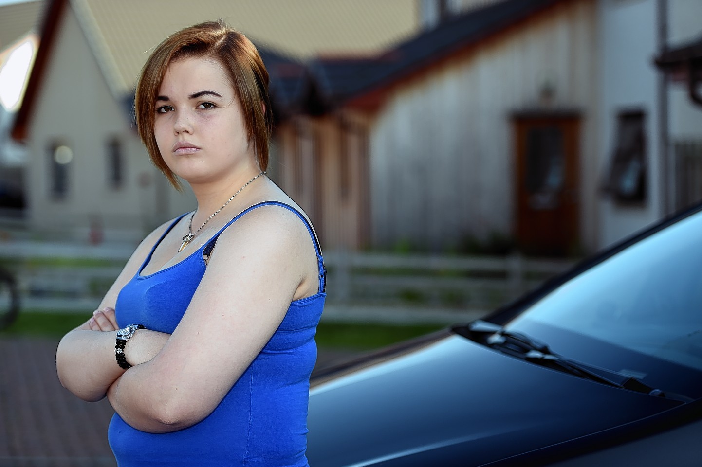 Shannon Grant, with her car after it was vandalised while she was in the hospital