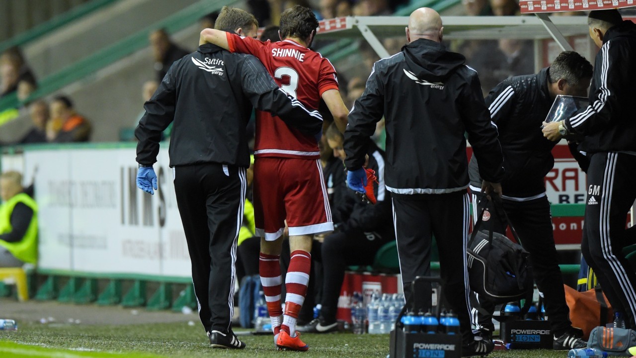 Graeme Shinnie limped off against Hibs