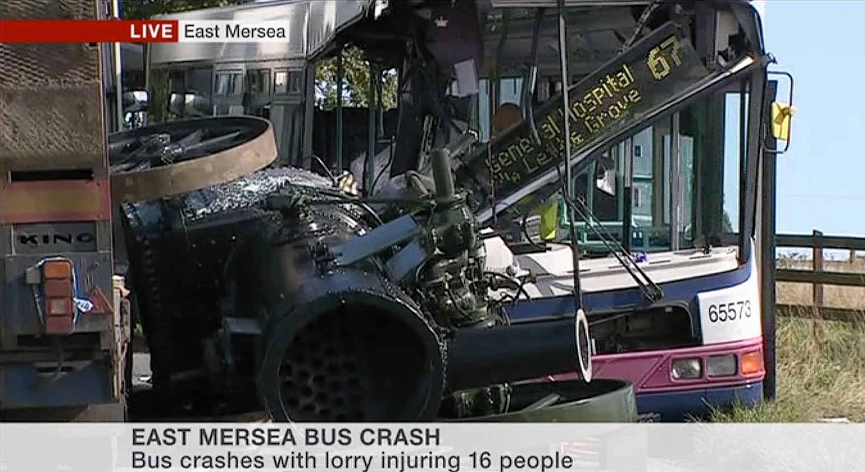 Local TV image after a lorry carrying a steam engine hits a bus 