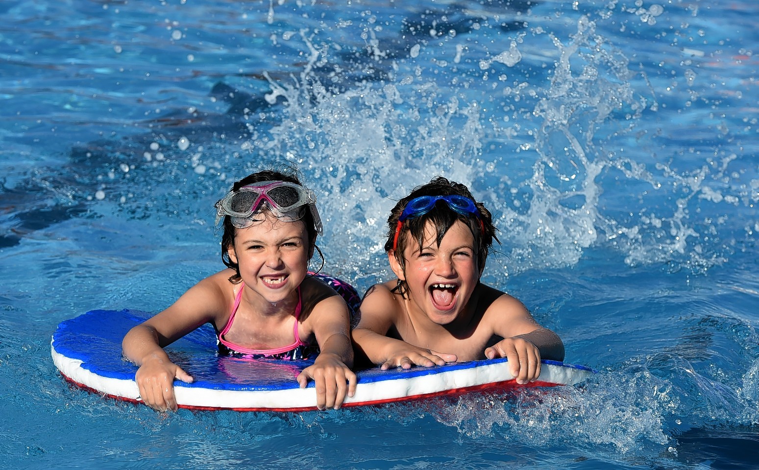 Jessica Brown, 7, and Marcus Summers, 7 enjoying the final day of the season. Picture: Kenny Elrick.