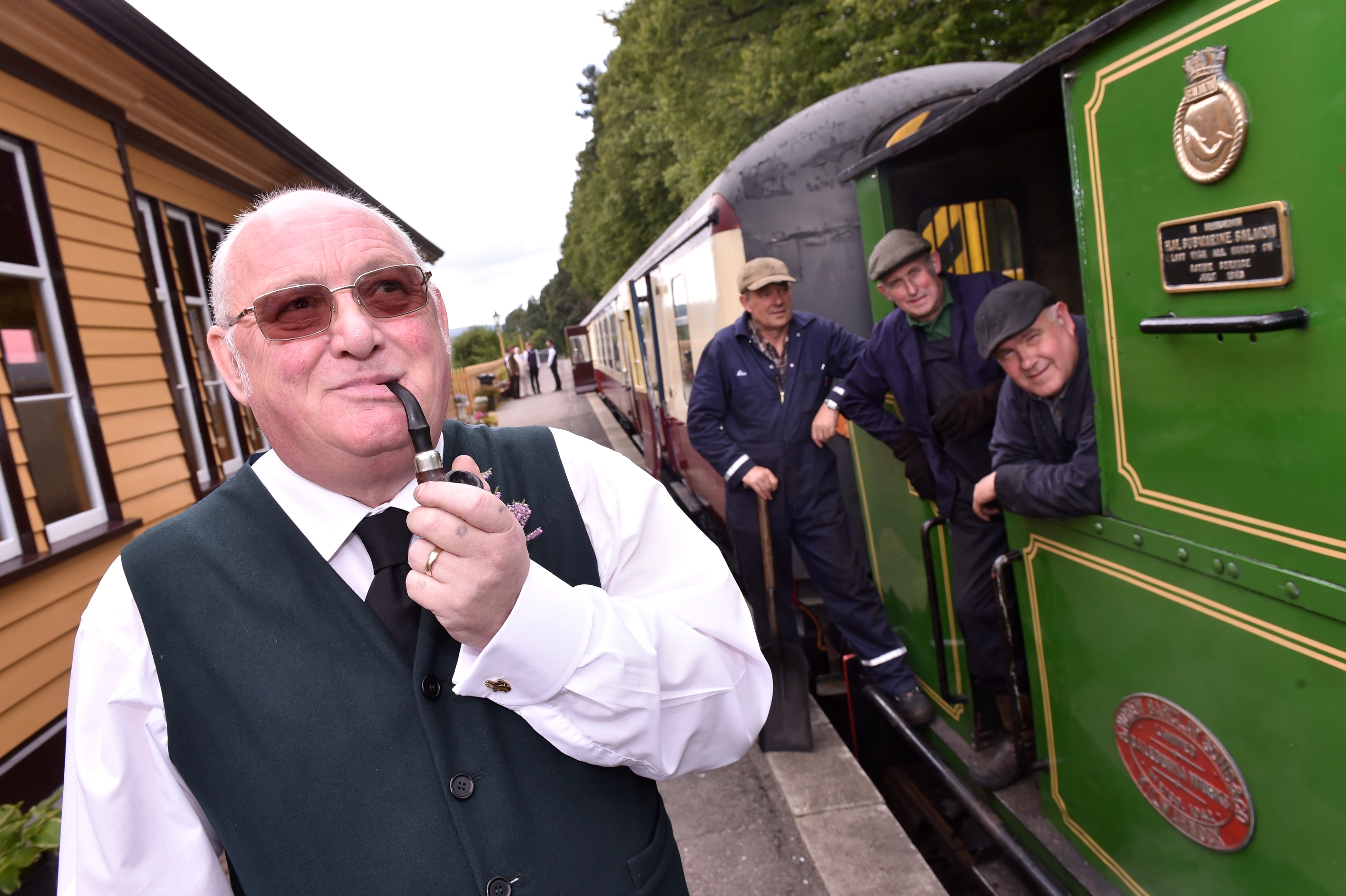 Milton of Crathes Station - the wedding of Shaun Allan and Carol McLaughlin had taken place on the moving carriage. David Pearson, membership secretary at Crathes with engineers. Picture by COLIN RENNIE  September 10, 2015.