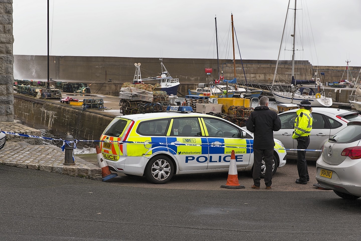 Police on the scene at Whitehills harbour following the discovery of the body