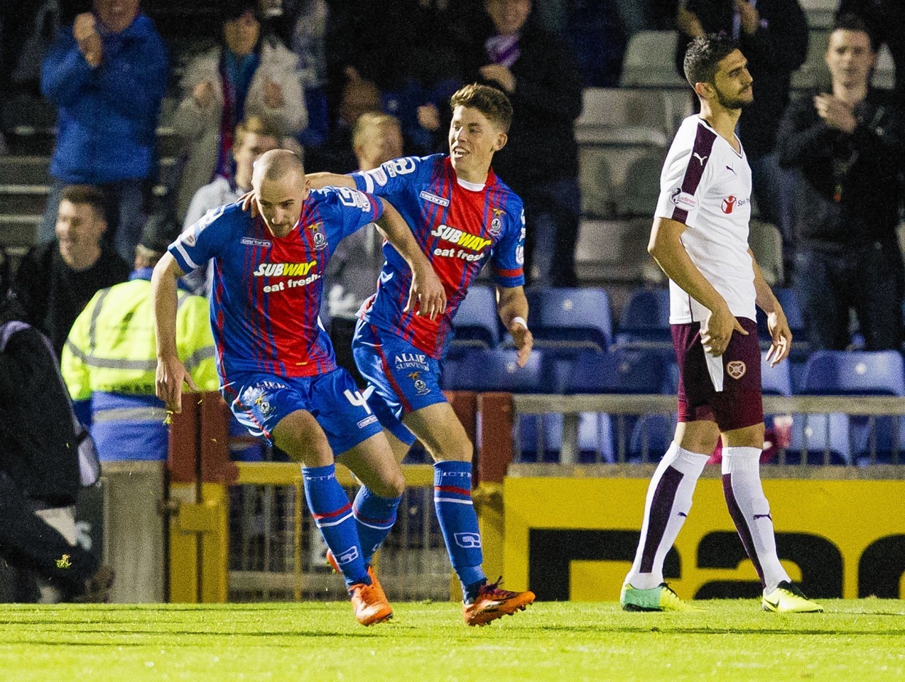  James Vincent (left) is congratulated by team mate Ryan Christie after opening the scoring for Inverness CT