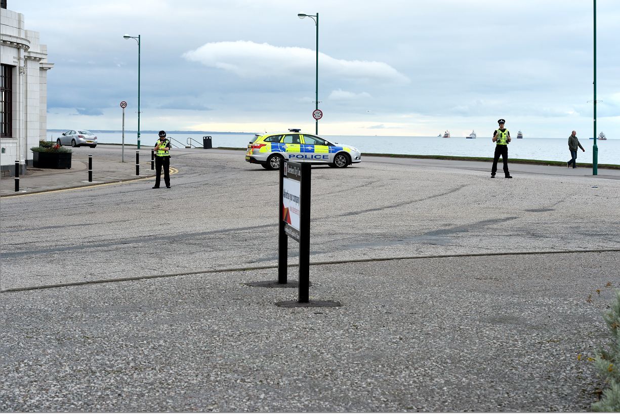 Police at the scene of the bomb washed-up on Aberdeen beach