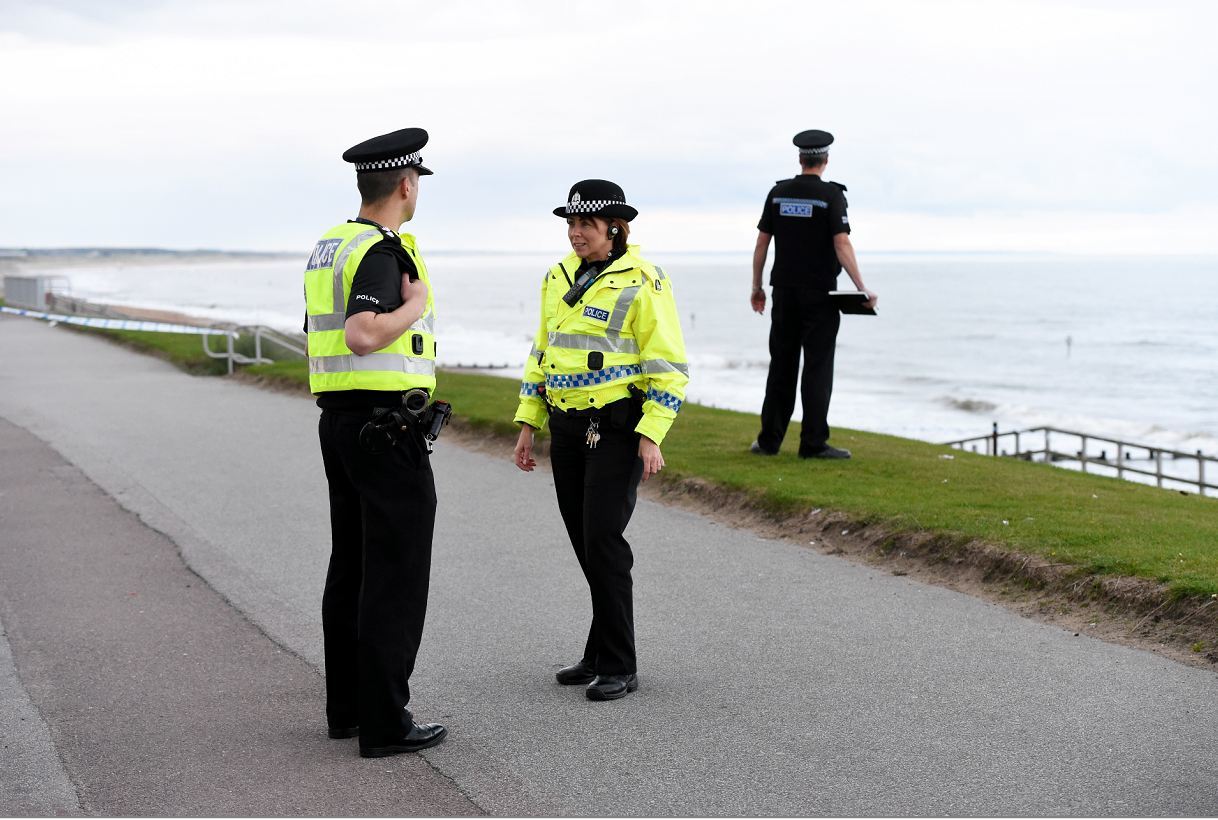 Police at the scene of the bomb washed-up on Aberdeen beach