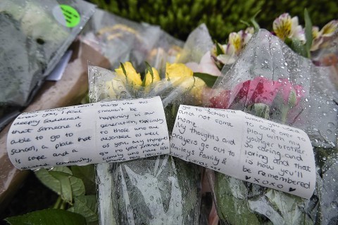 Tributes in memory of Bailey Gwynne are seen outside the gates to Cults Academy near Aberdeen, Scotland on October 29 2015. The 16-year-old schoolboy was fatally stabbed yesterday afternoon at the school on the outskirts of Aberdeen. Another 16-year-old boy has been arrested by Police Scotland. The school is due to remain closed for the remainder of the week whilst Police investigations take place. Police Scotland have said that they are treating the teenager's death as murder.