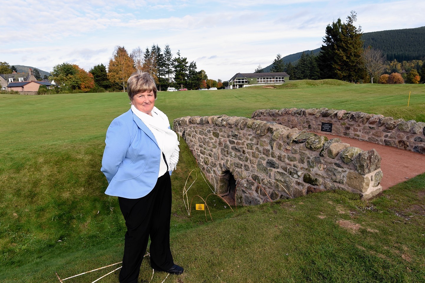 Ballater Golf Club ladies captain, Sandie Barns, beside the new bridge at the 18th hole to mark 100 years since the first women began playing on their greens.