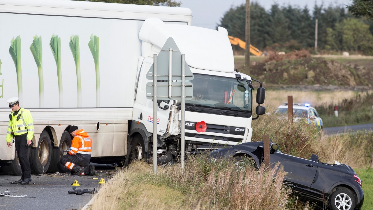 Man killed in early morning crash between car and lorry