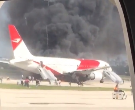The Dynamic Airways plane on fire in Florida