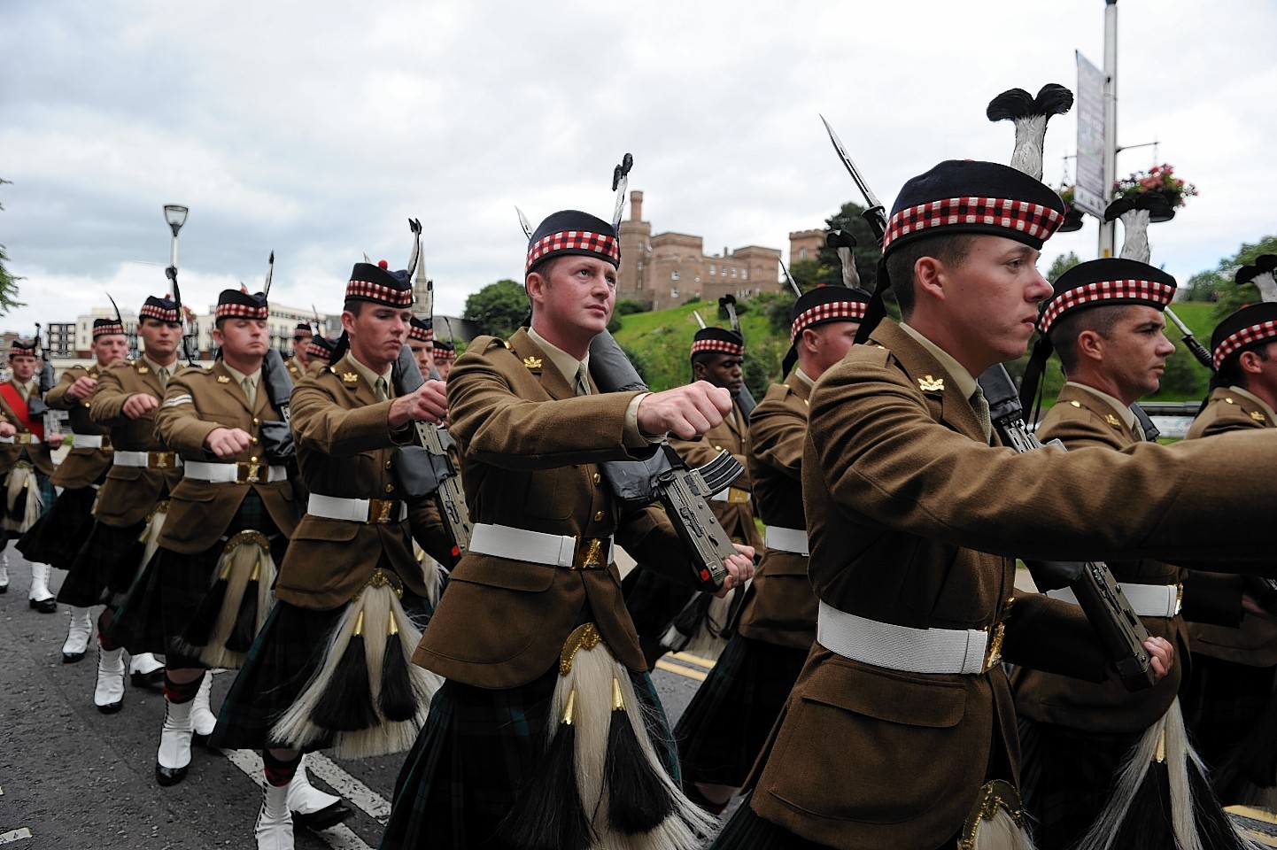 The Highlanders as they marched through Inverness in June 2014