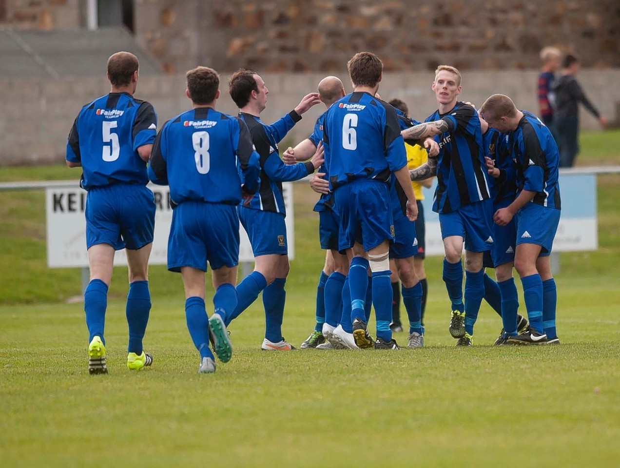 Huntly players celebrate during Saturday's 5-1 win