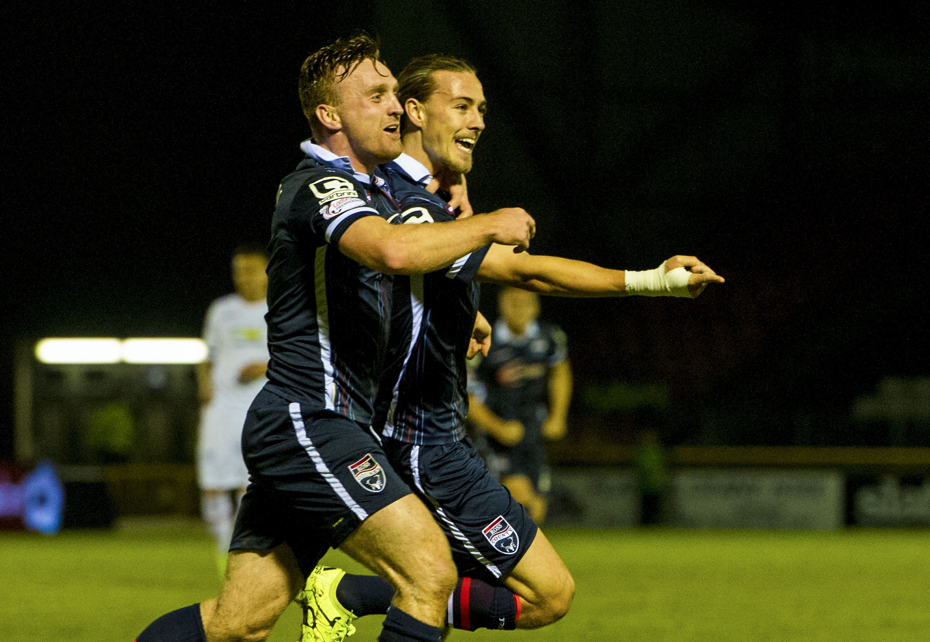 Jackson Irvine celebrates his League Cup opener against Caley Thistle with Ross County team-mate Craig Curran