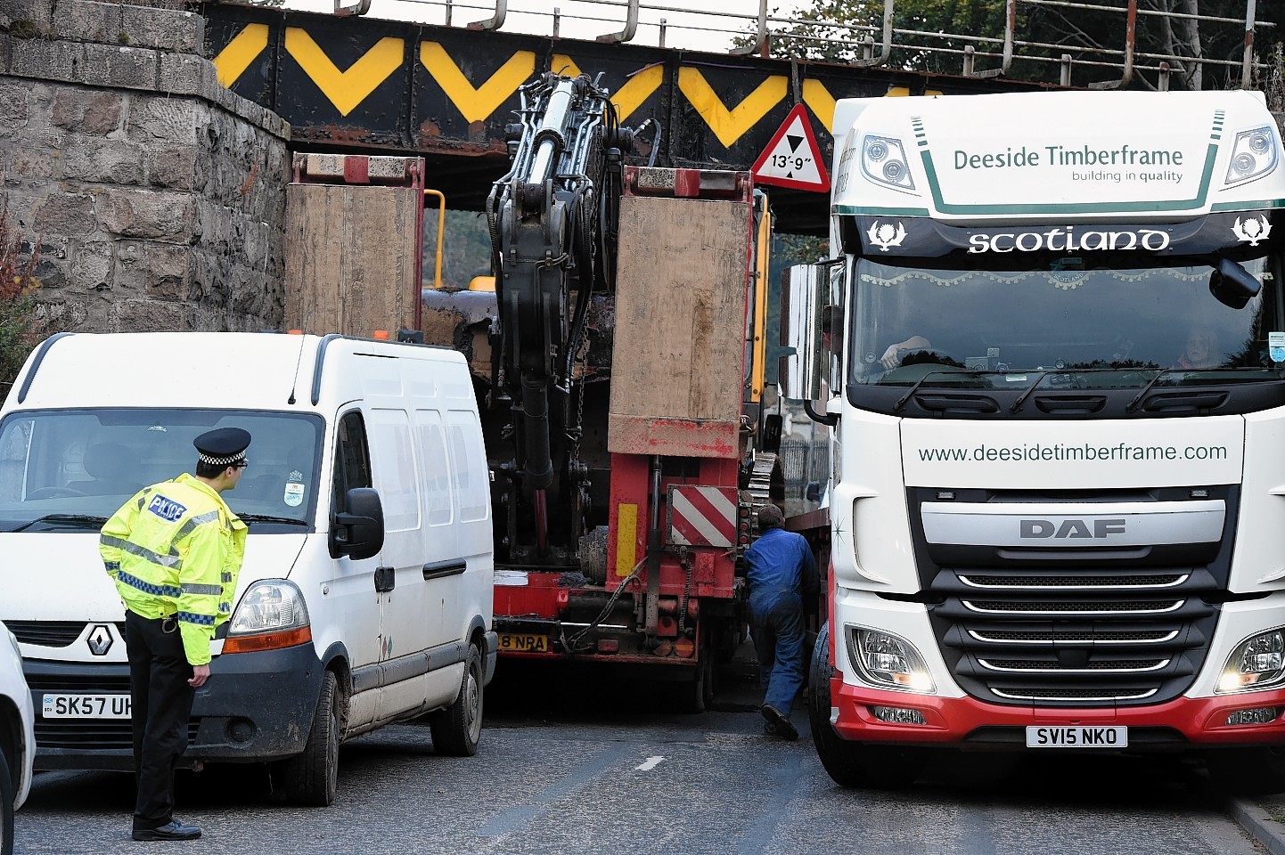 A lorry, left, gets stuck on the B993 Keithhall road at Port Elphinstone, Inverurie