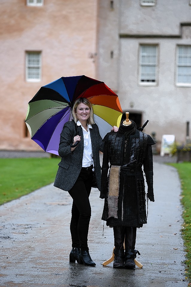 Esme Saville, assistant tourism operations manager for Moray/Speyside Tourism, with the Macbeth battle costume, at Brodie Castle.